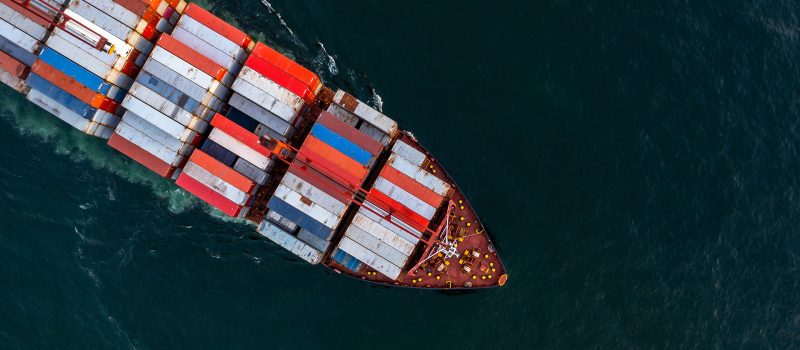 Aerial view of cargo container ship on the water.