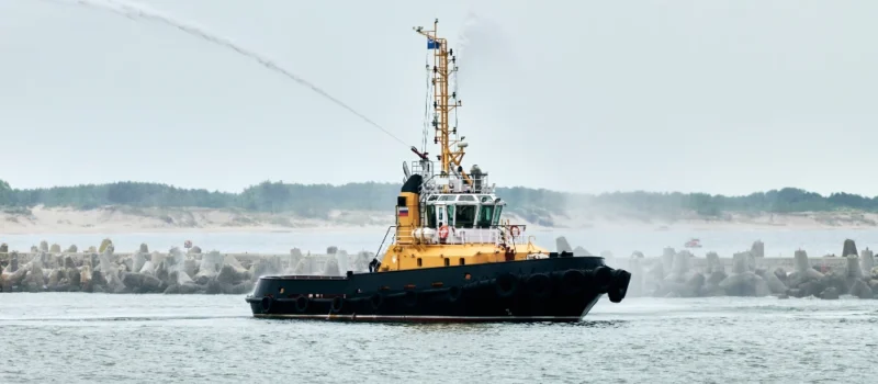 Fireboat ship sailing on open sea.